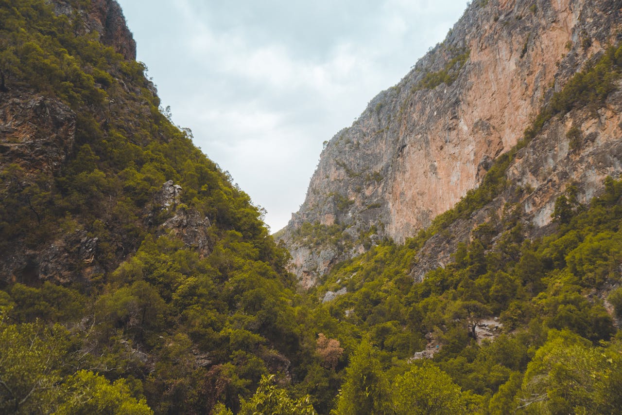 Dramatic rocky canyon walls and green valley near Akchour, Morocco — hiking country near Chefchaouen